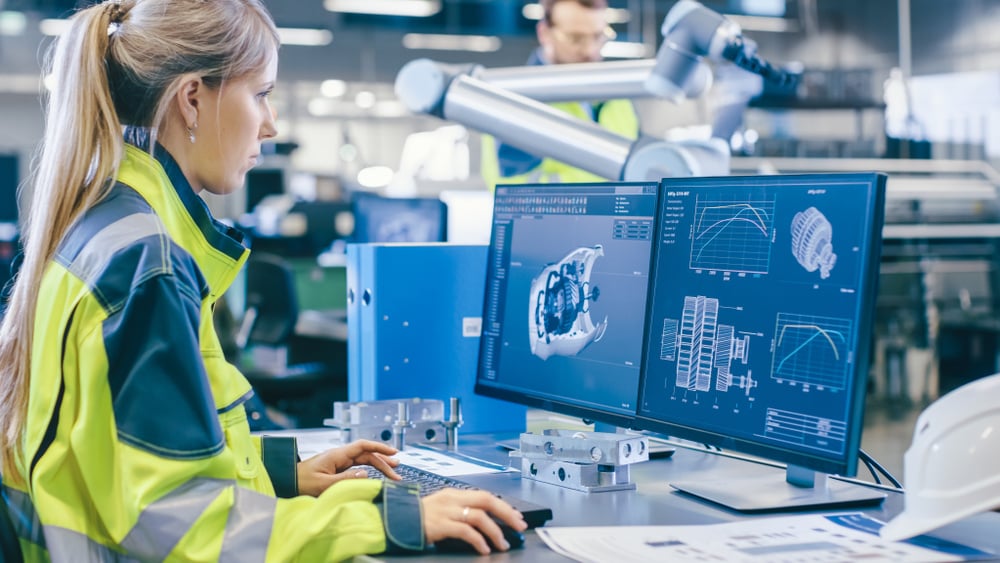 an employee in a manufacturing facility using their tablet to learn how model based enterprise transforms product lifecycle management